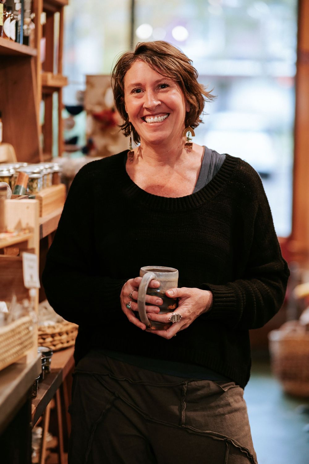 Cozy indoor portraits showing relaxed moments with coffee cup in rustic setting.