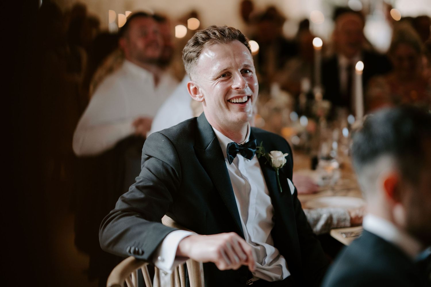 wedding guests laughing during father of bride speech at ivy lodge in cirencester