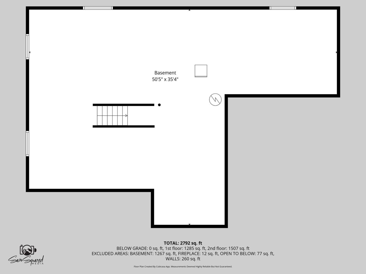 Black and white architectural floor plan showing stairs and room layout with dimensions.