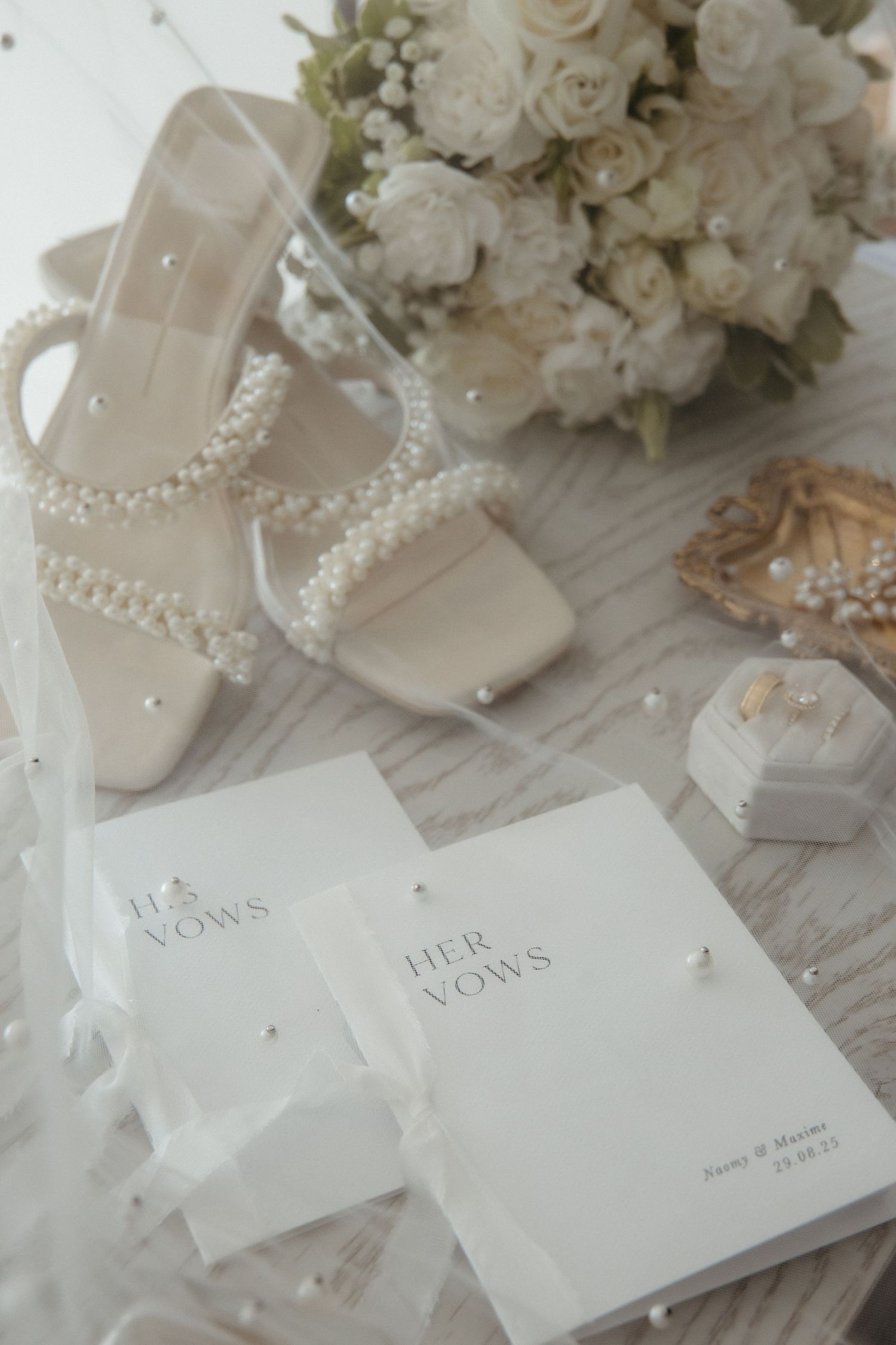 elegant classic wedding flat lay photography detail photos bride's bouquet, shoes, vows, wedding rings and veil, romantic wedding photograph