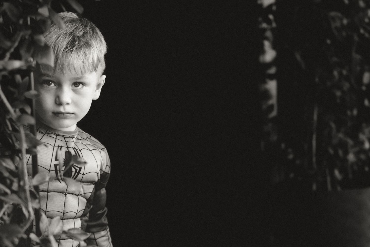 Vintage black and white photograph showing a sequence of six childhood portraits in a filmstrip style format.