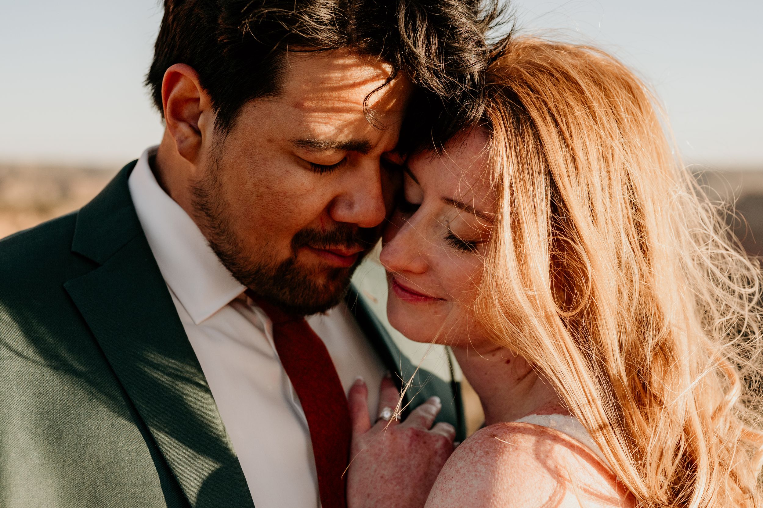 A romantic sunset photo sequence showing a couple in close embrace against warm lighting.