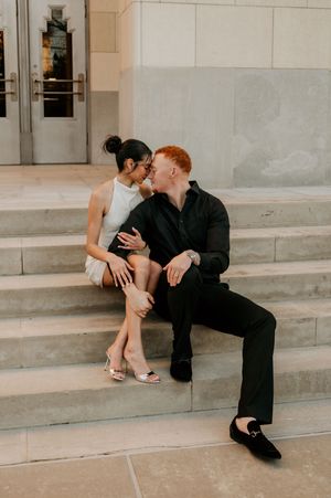 Intimate moments captured on concrete steps in warm evening light.
