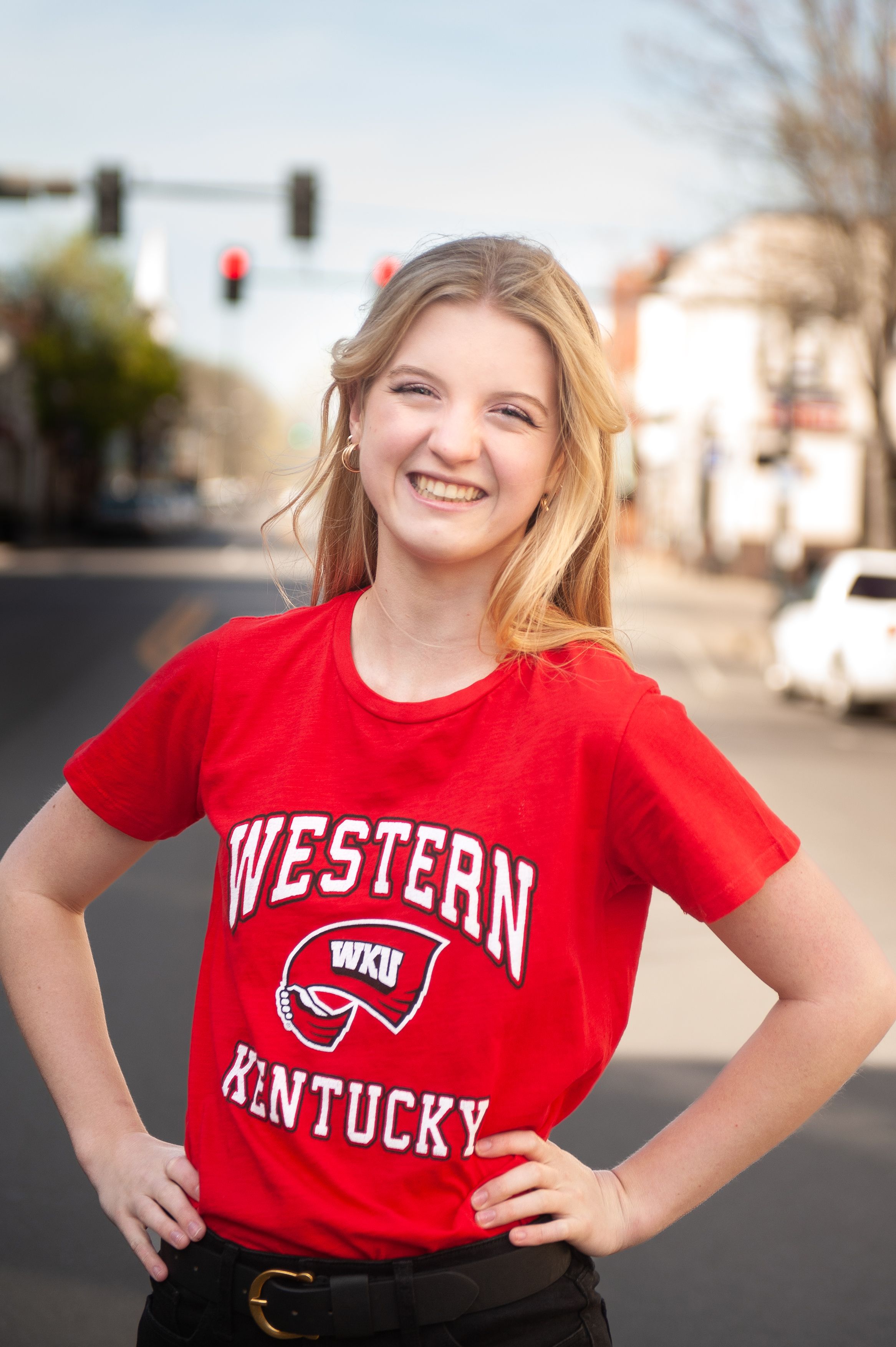 A series of photos showing red Western Kentucky University t-shirts and apparel worn outdoors on a sunny day.