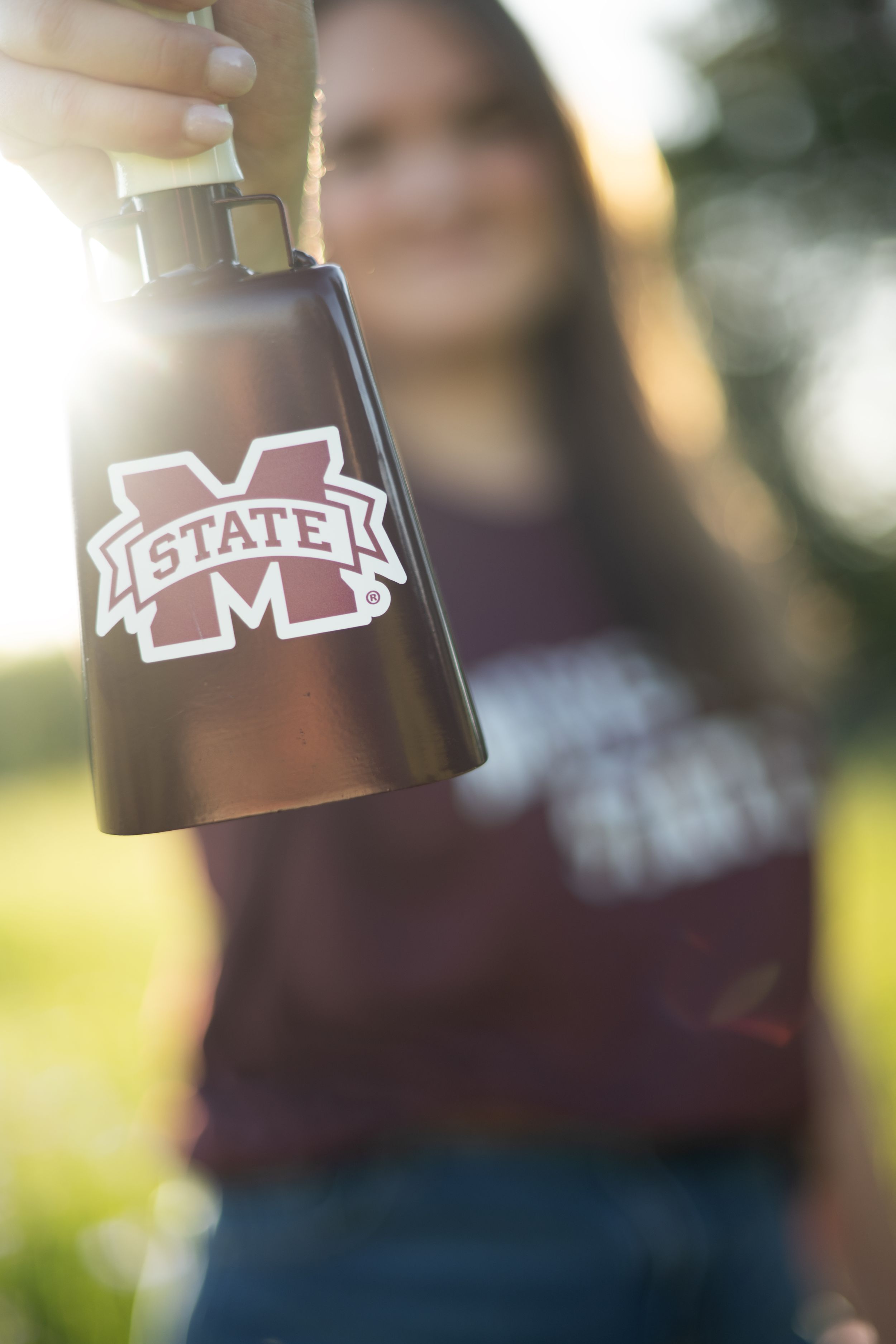 Three blurred photos showing Mississippi State University and MSU logos on maroon backgrounds.