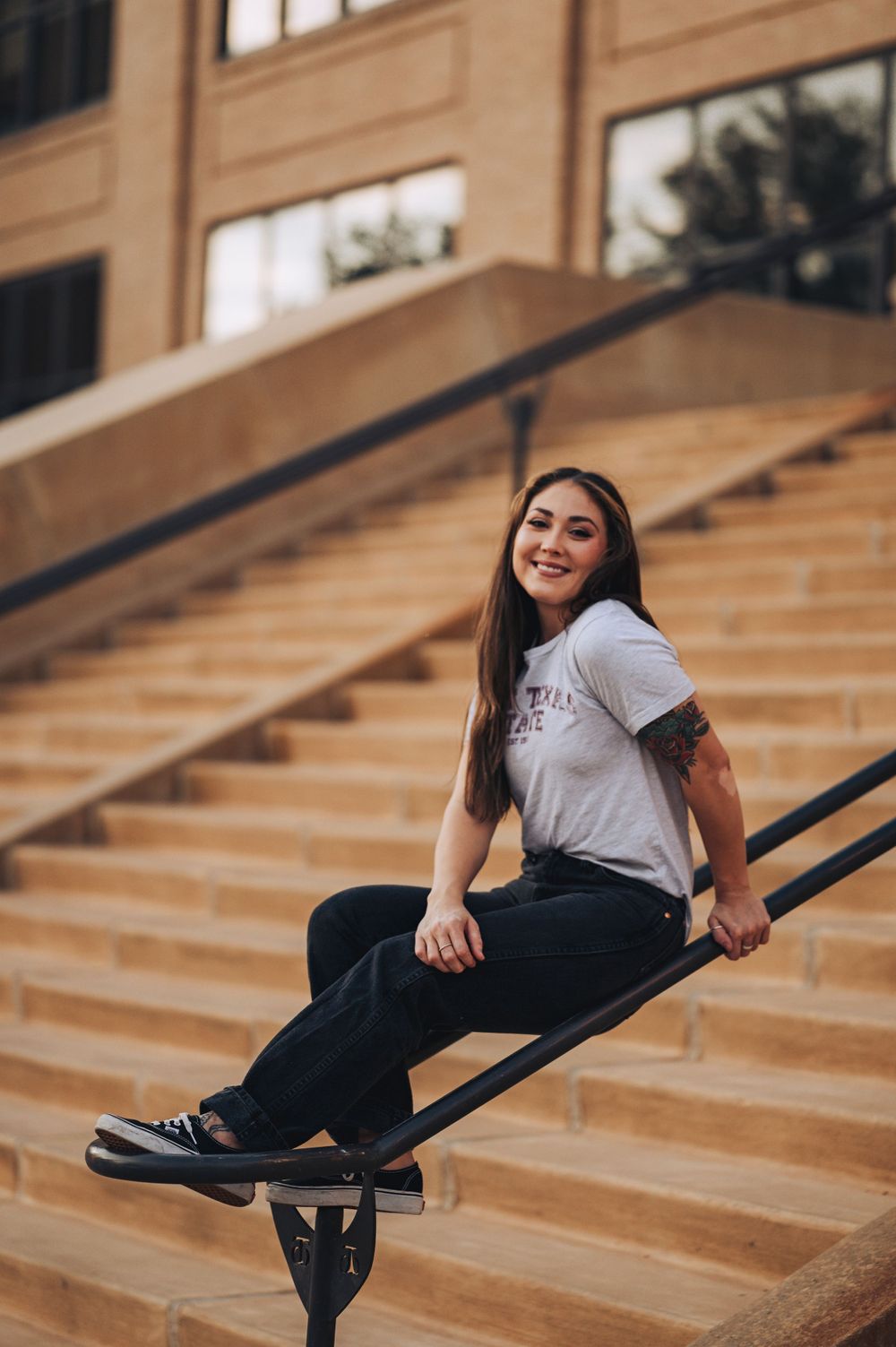 A casual photo session on concrete steps showing relaxed poses in casual attire.