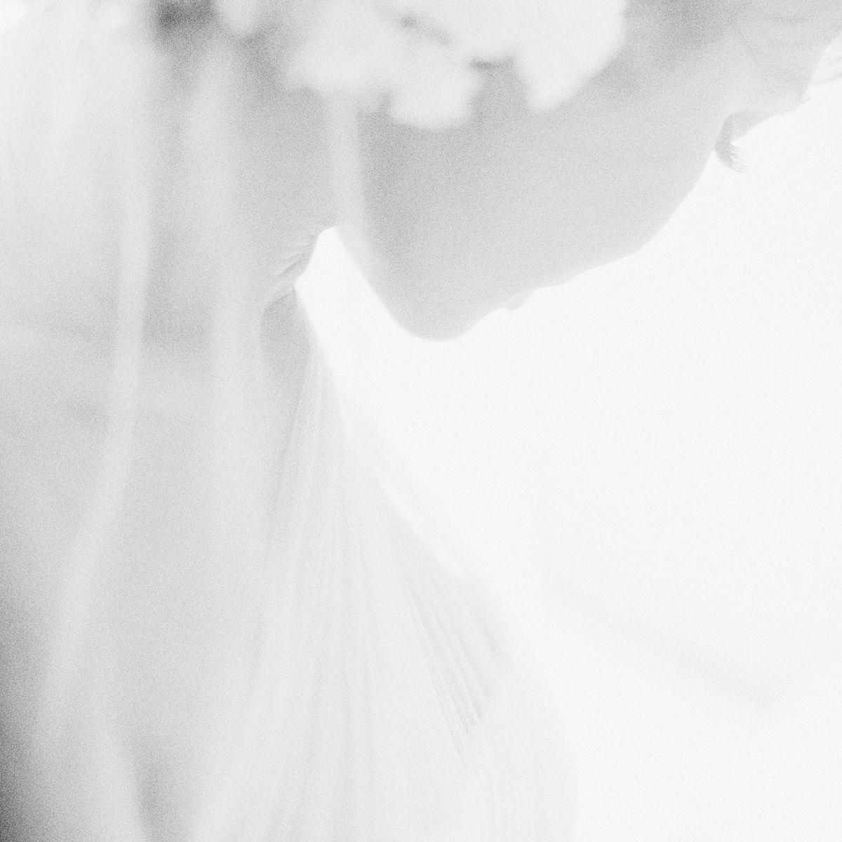 Ethereal bridal portrait at Tirtha Uluwatu in Bali, photographed during a destination wedding celebration.