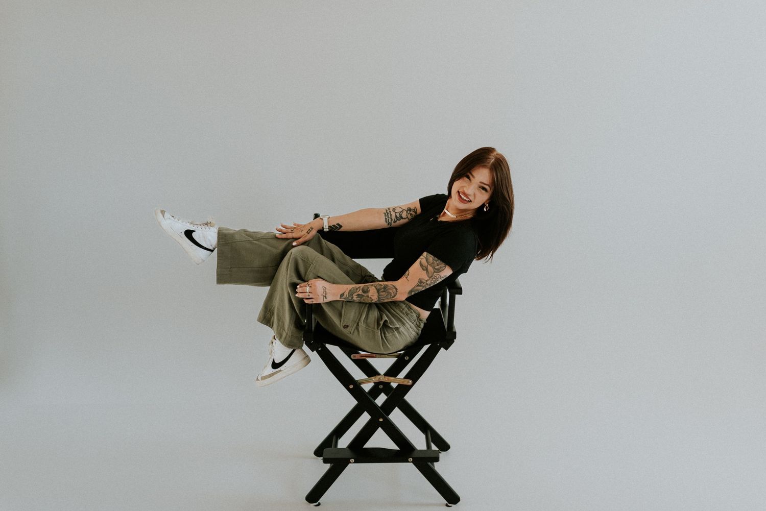 Branding photo of a photographer sitting in the director's chair in studio in Clarksville, Tennessee.