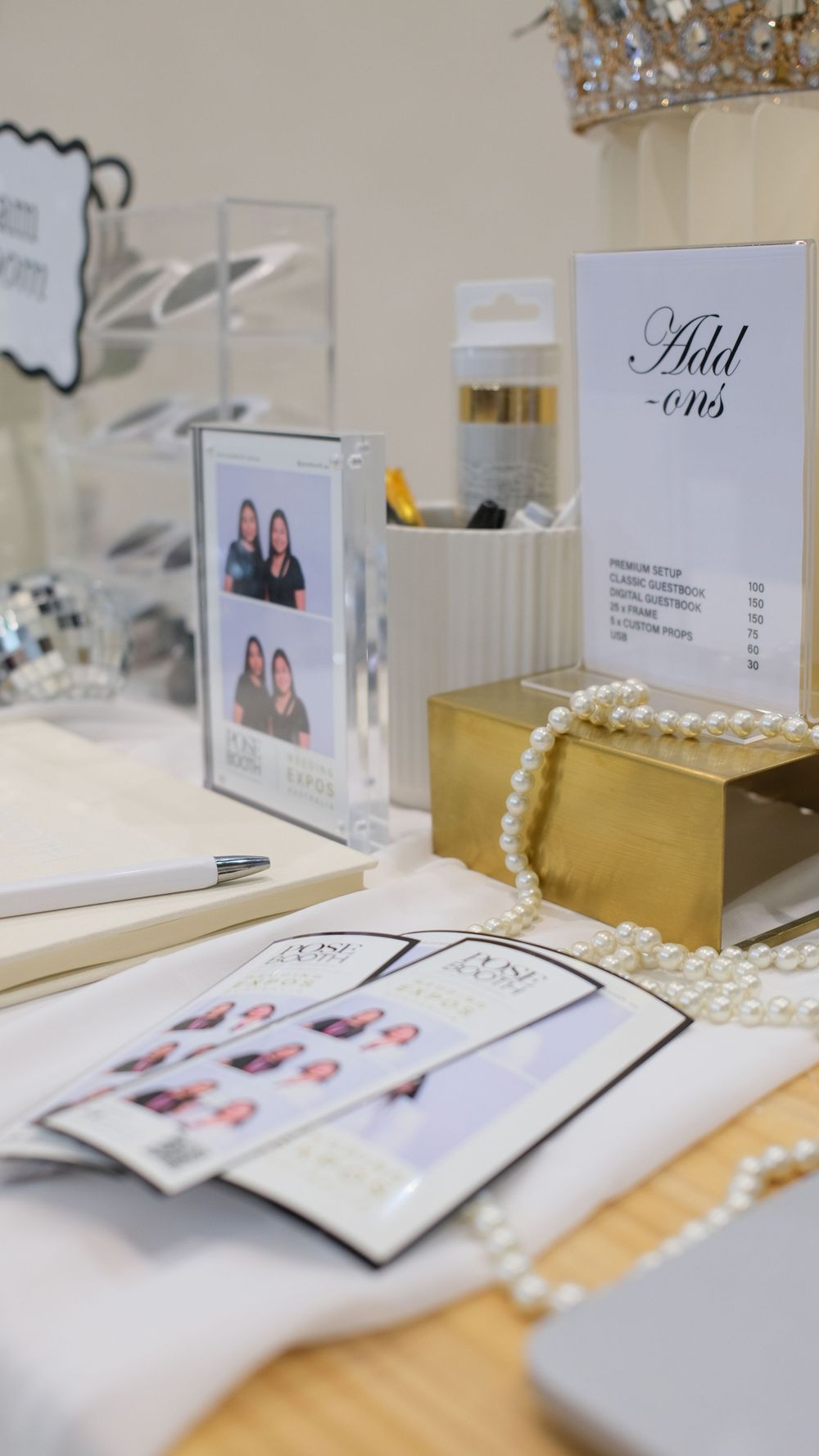 Wedding photo booth station with price lists, pearl necklaces, and golden gift boxes. Perth WA Photo booth Hire Event Booth