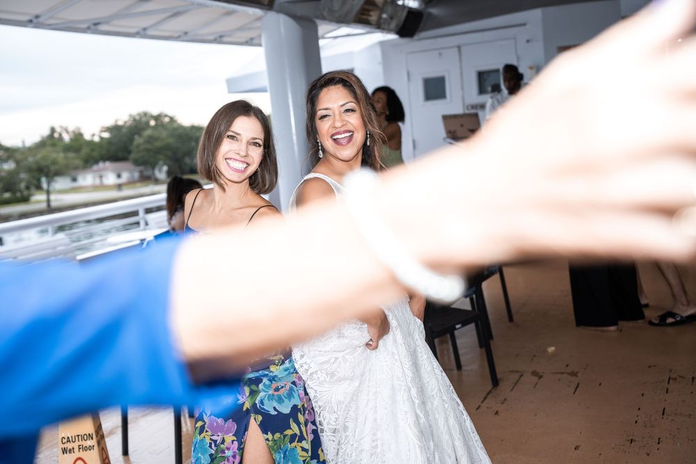 Guests celebrating and dancing at a festive boat party event. Micro wedding on Yacht StarShip in Tampa