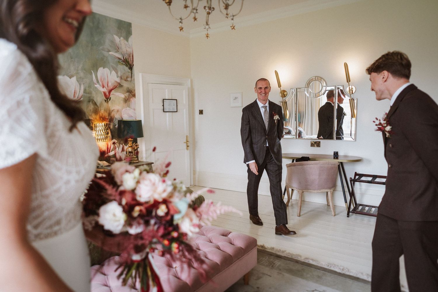 Wedding venue interior with floral arrangements and elegant decor.