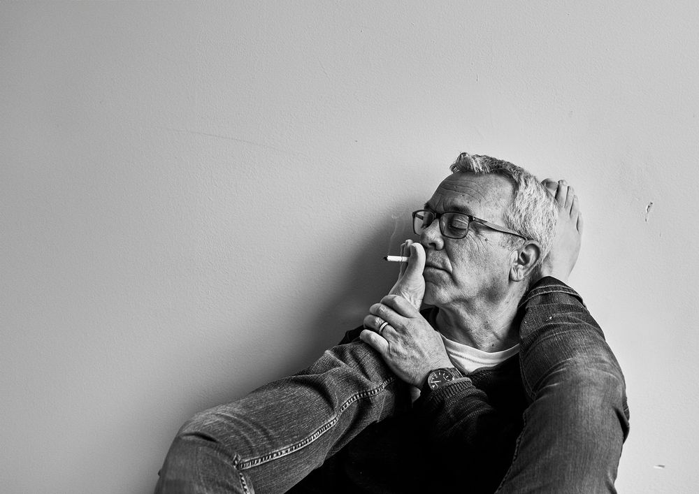 Black and white portraits showing different emotional expressions against a light background.