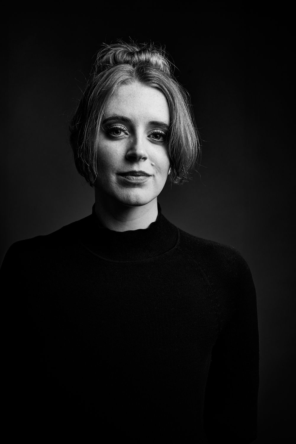 Dramatic black and white portrait series featuring artistic lighting and shadows.