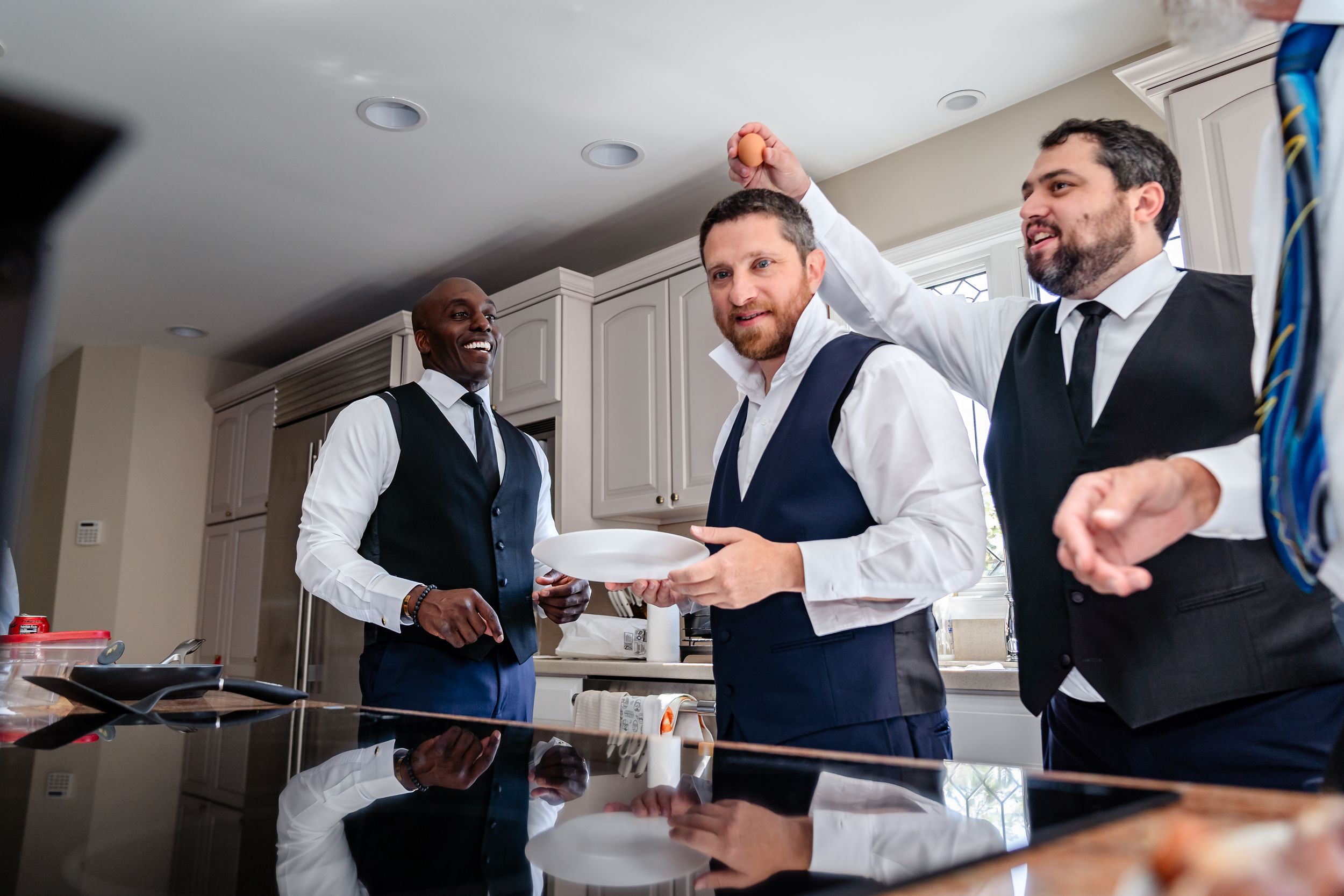 A sequence of candid shots showing groomsmen joking around and laughing together before the ceremony.