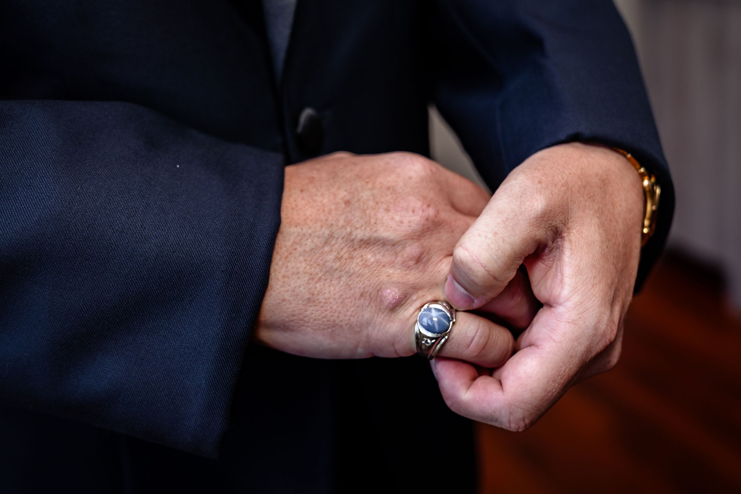 Close-up shots of hands adjusting formal wear accessories and cufflinks.