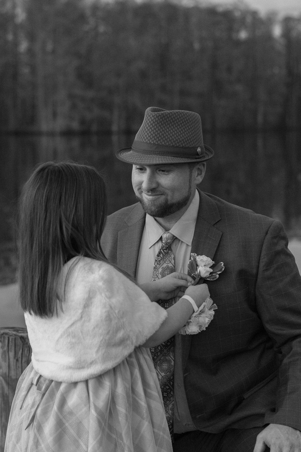 Father and daughter smiling together during sunset portrait session near Edenton waterfront
