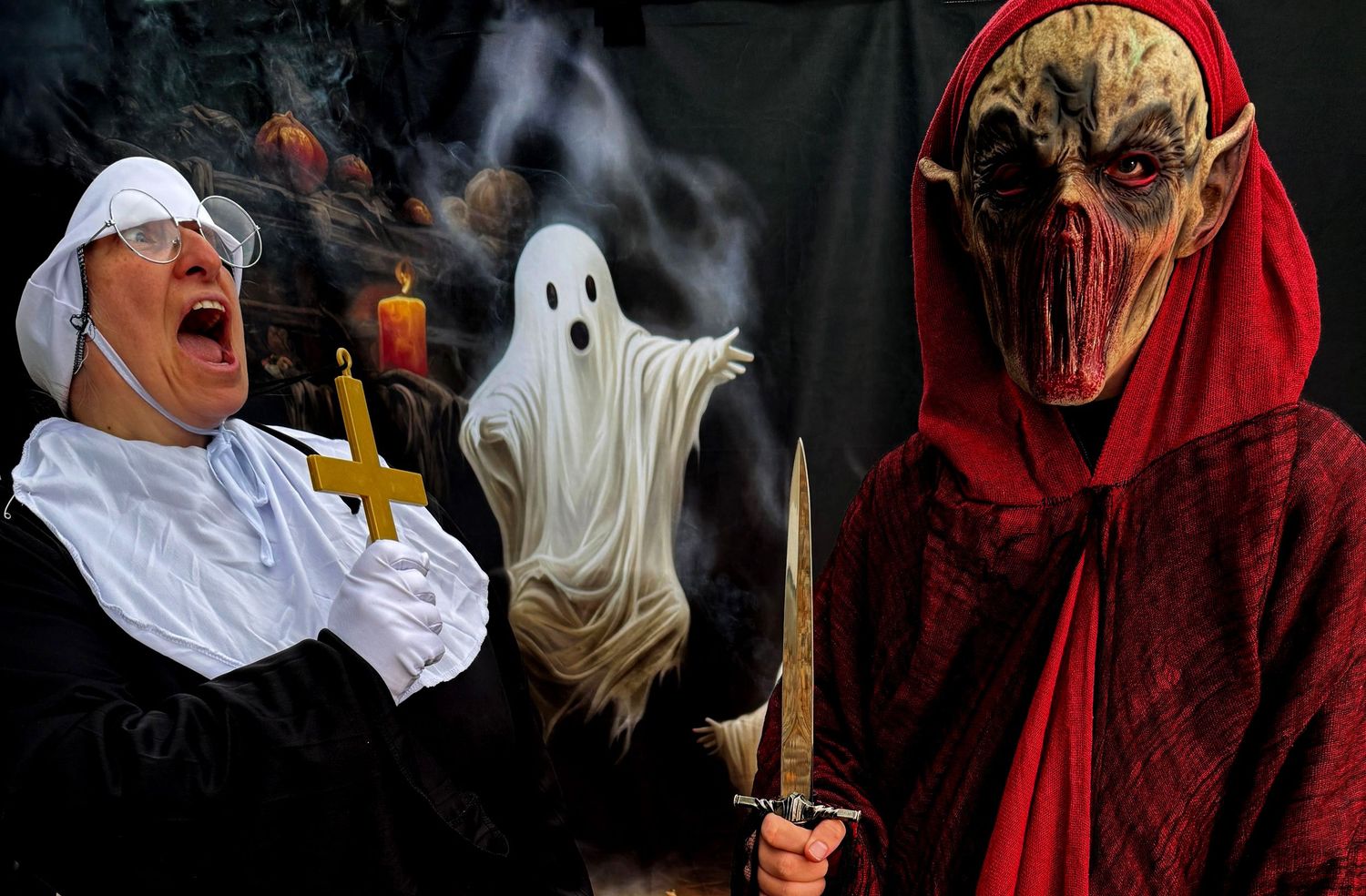 A spooky Halloween scene with ghost decorations, candles, and a person in a red dress surrounded by eerie smoke.