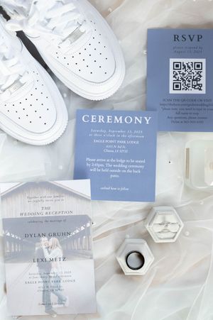 Modern wedding invitation suite in white and gray with QR code and ceremony details.