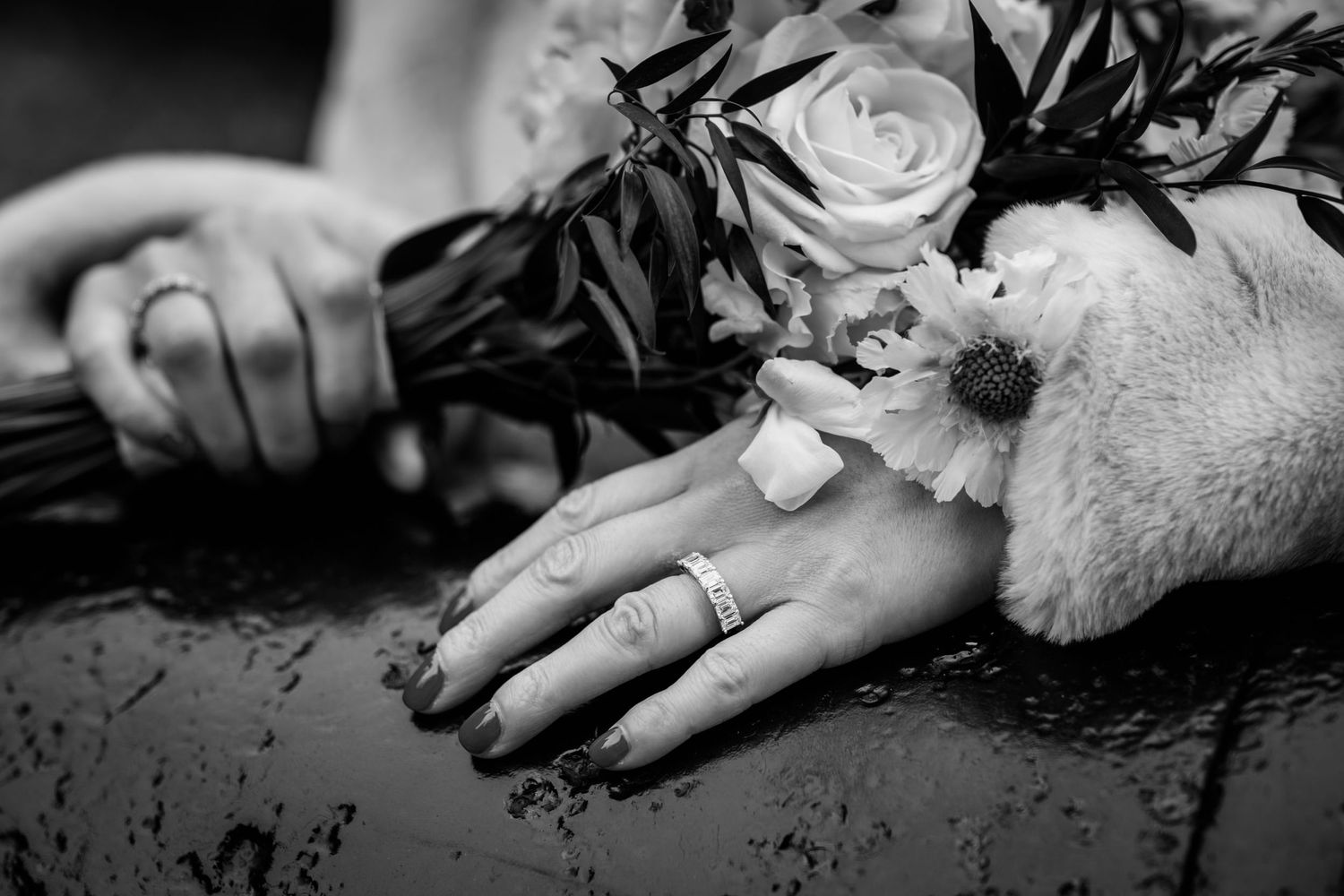 A dramatic black and white series of hands reaching and grasping in various expressive poses against dark backgrounds.