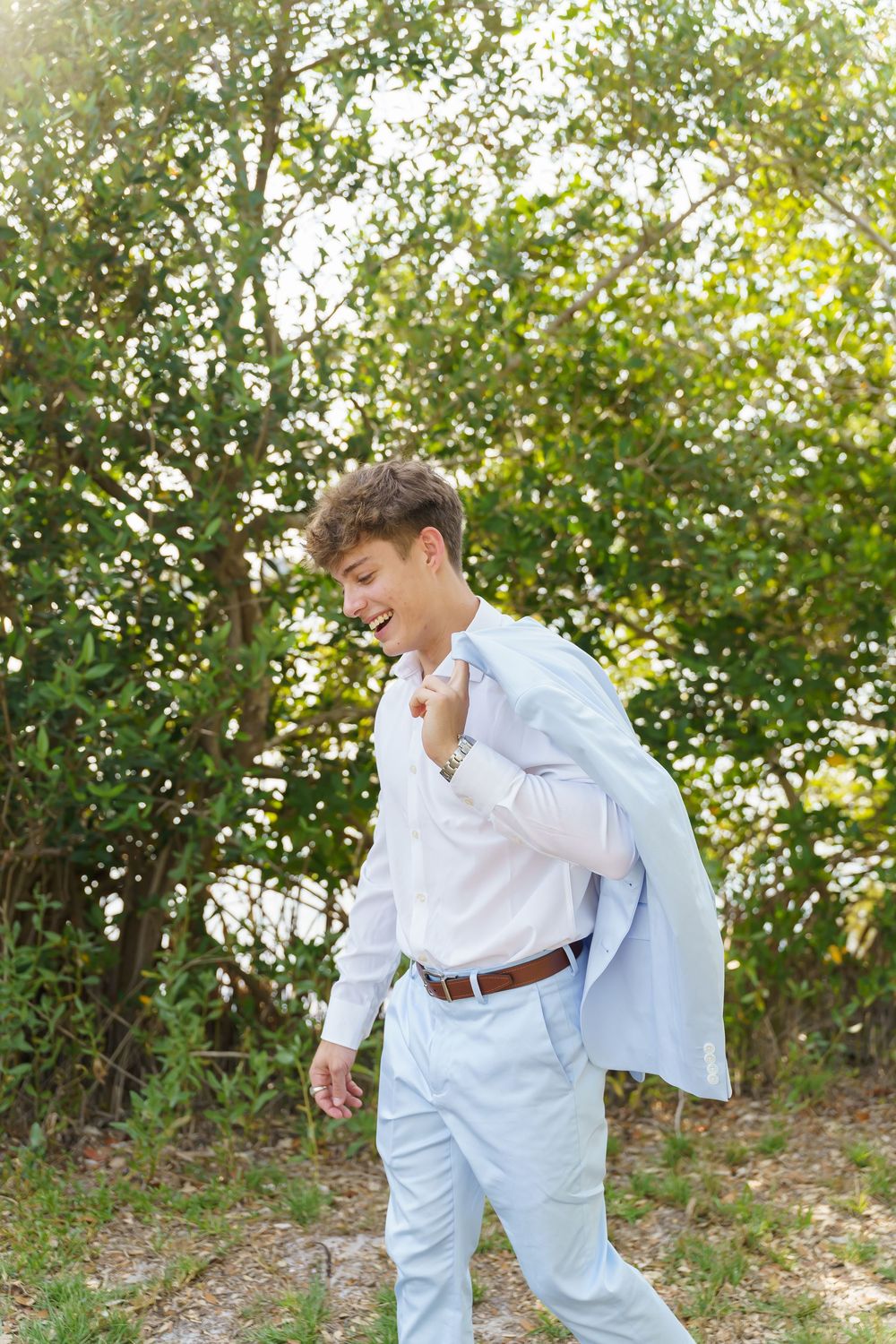 A series of candid outdoor portraits showing joyful moments in a natural setting with sunlit trees in the background.