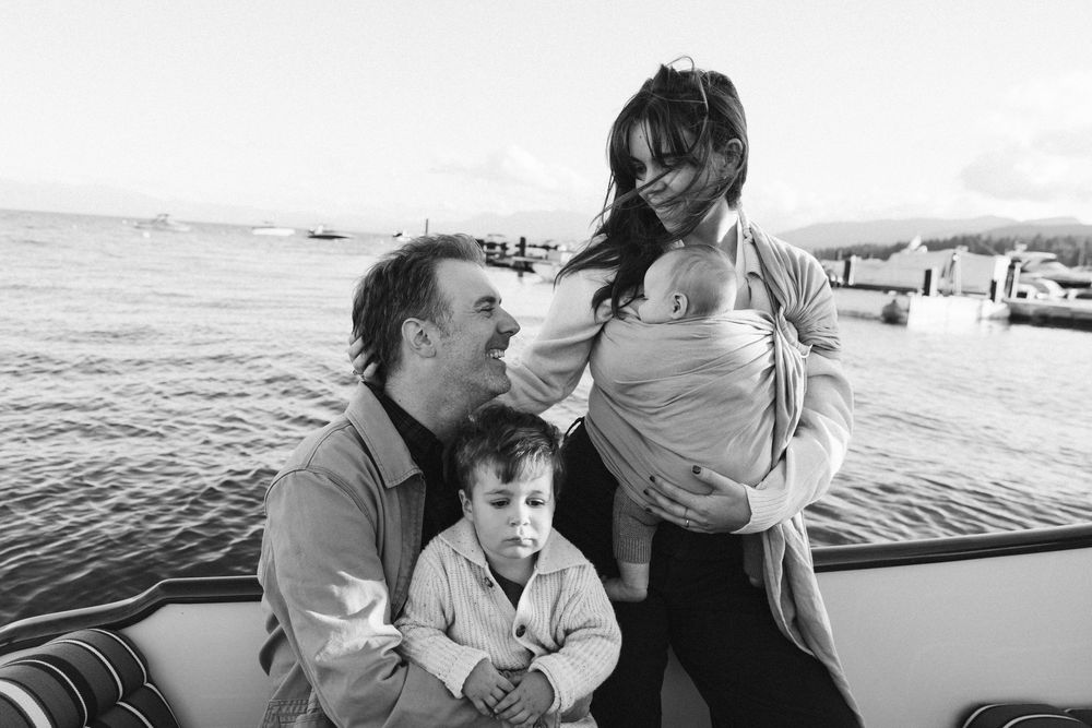 Candid family moments captured on a boat during a sunny afternoon.