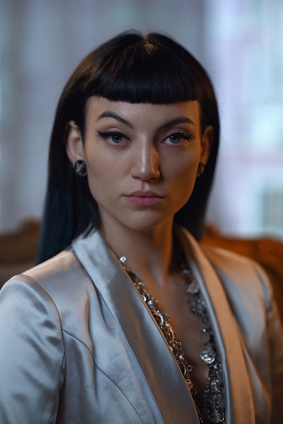 Executive portrait by Boyd Visuals. Subject's sharp gaze, striking style. Captured with authority for personal brand.