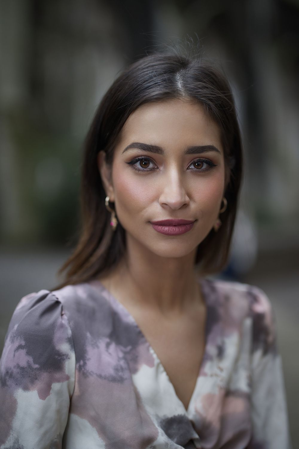 Empowering portrait by Boyd Visuals. Subject's welcoming gaze, natural light. Capturing warmth and genuine authenticity.
