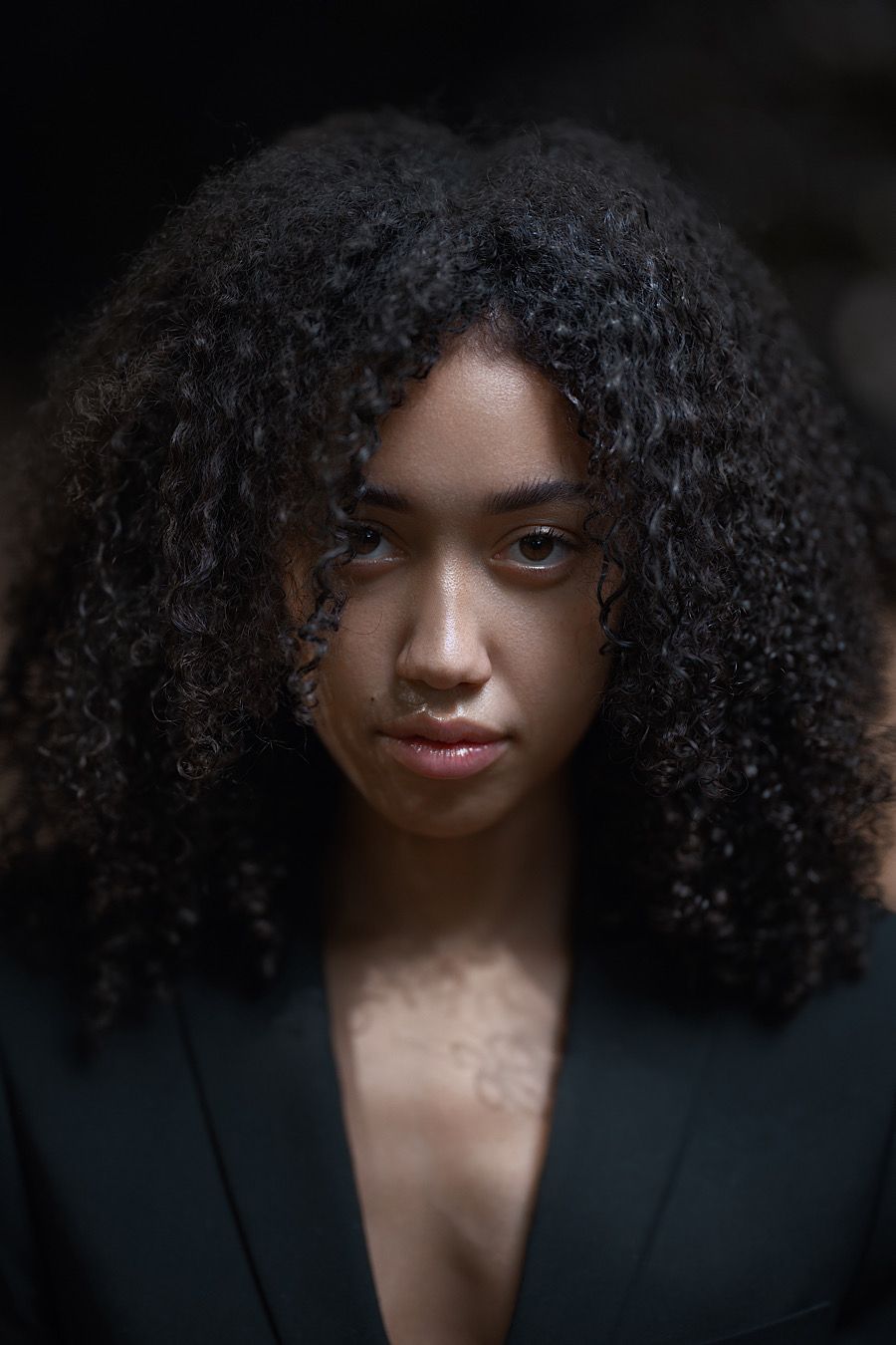 Gritty dimensional portrait by Boyd Visuals. Subject's vulnerable intensity, strong emotion. Capturing raw soul and spirit.