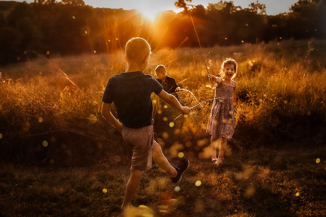 Children in sunset field – family photography Springfield Missouri.
