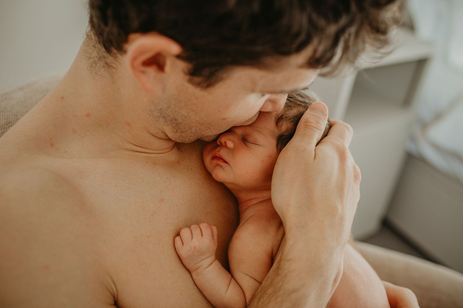 At-home newborn photography with parents in  London