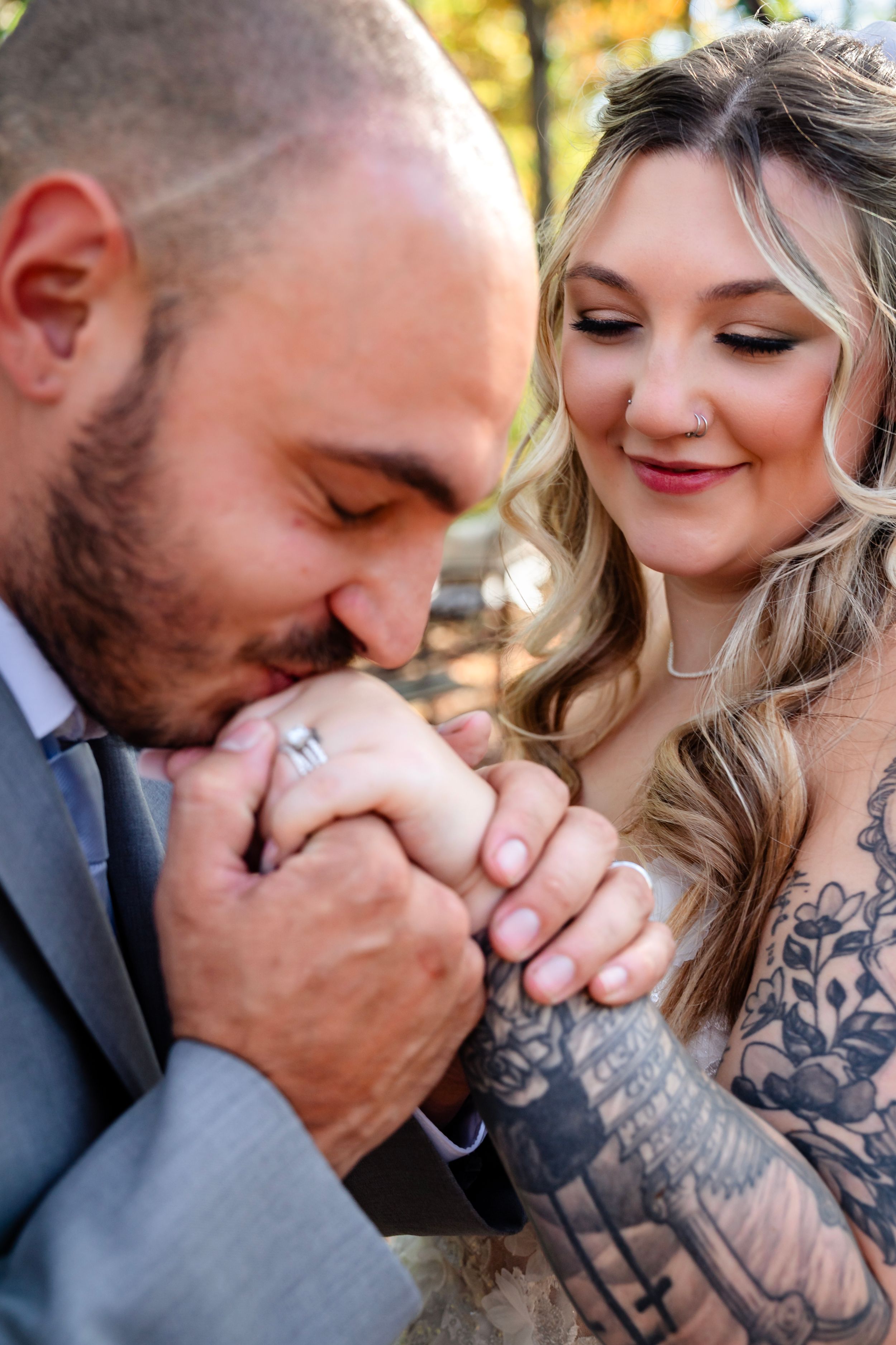 An intimate wedding portrait showing a tender moment between newlyweds.