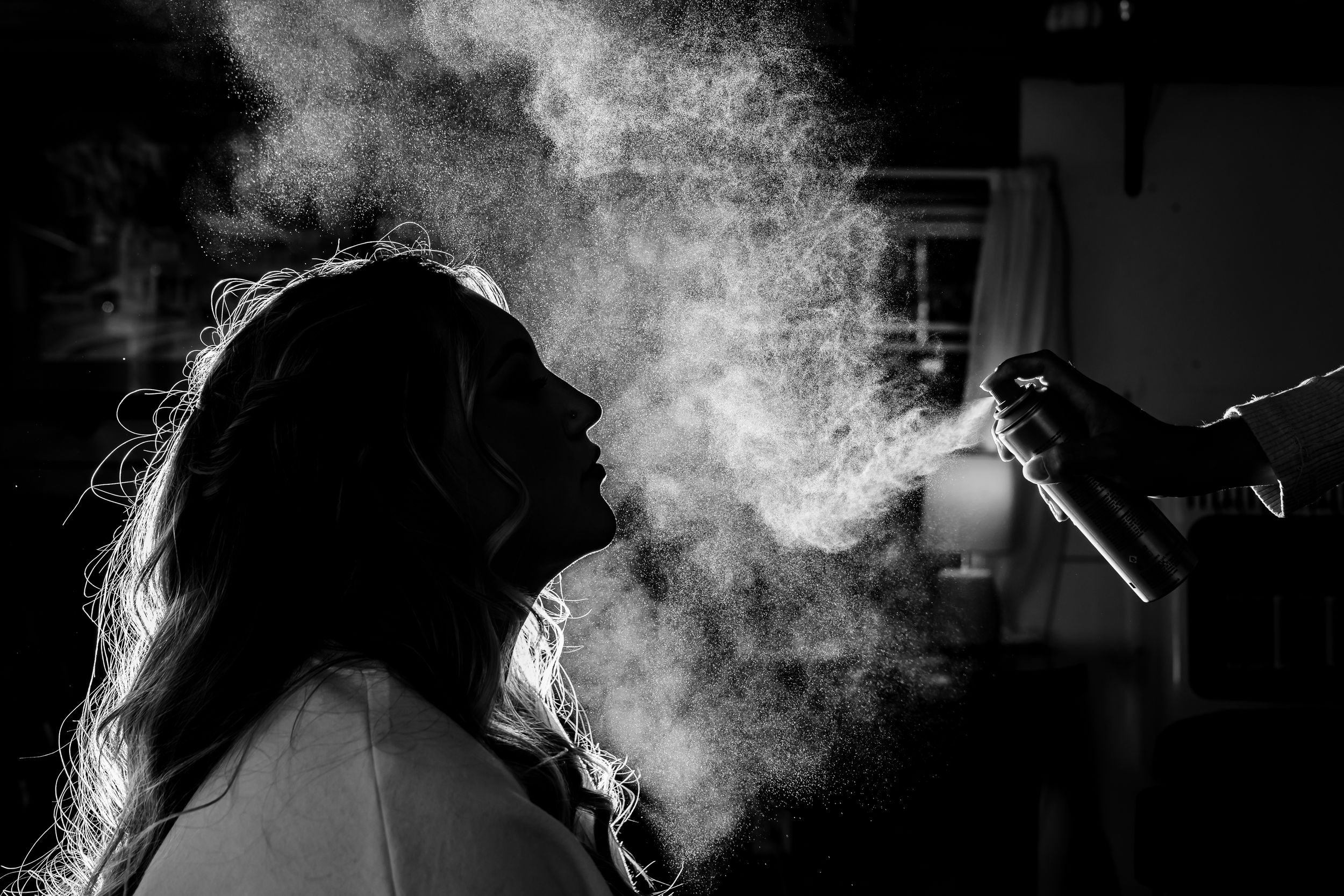 Dramatic black and white silhouettes with smoke effects creating an atmospheric mood.