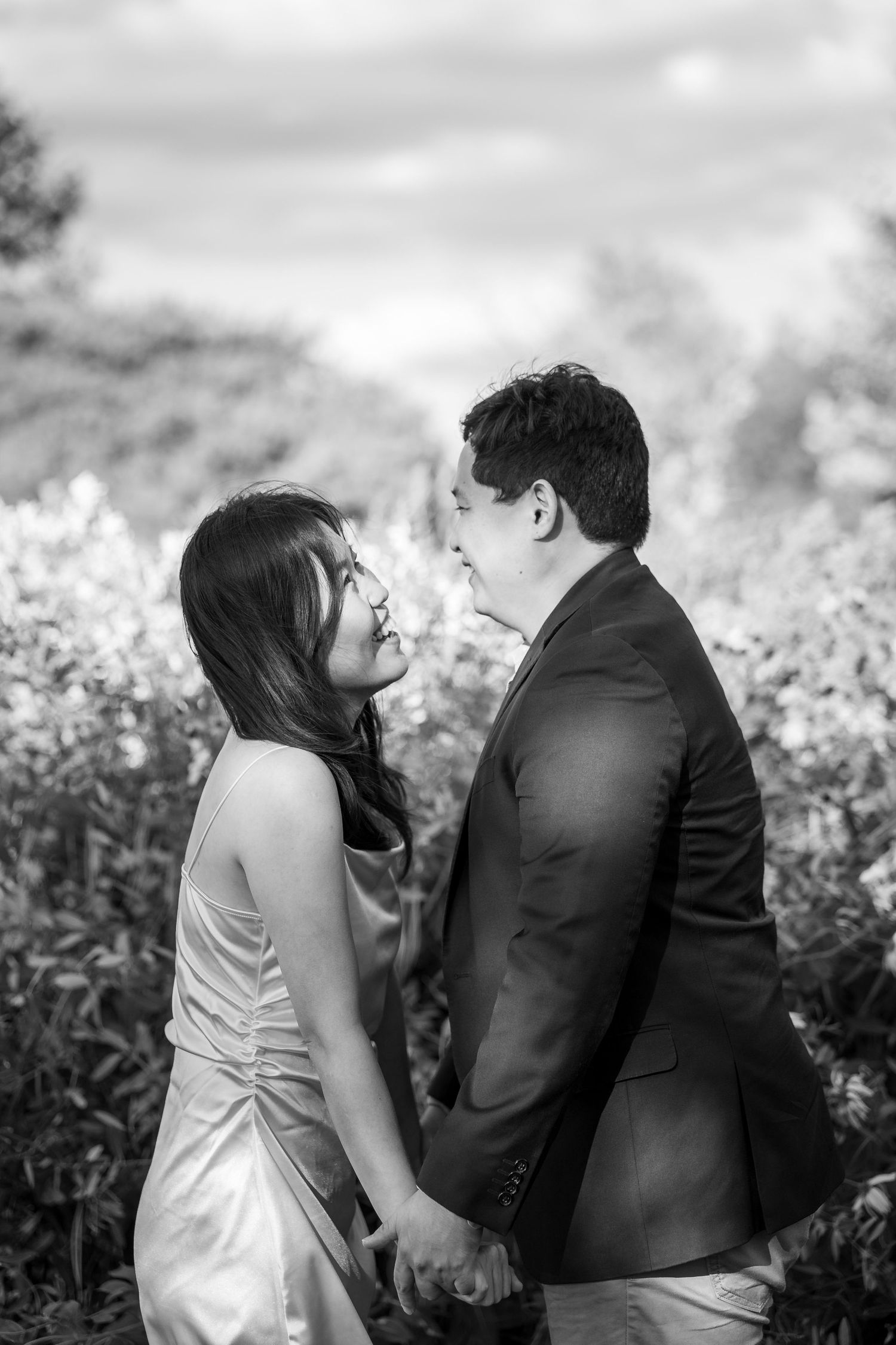 Black and white romantic couple portraits in a natural outdoor setting.