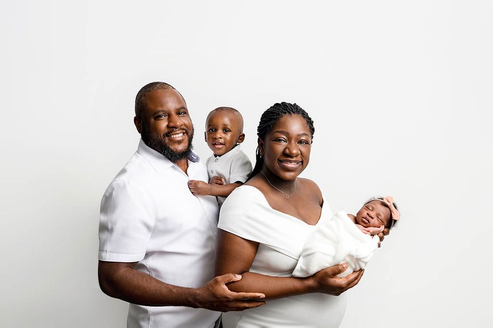 Family and newborn photoshoot in Hemet California with parents, baby girl, and big brother.