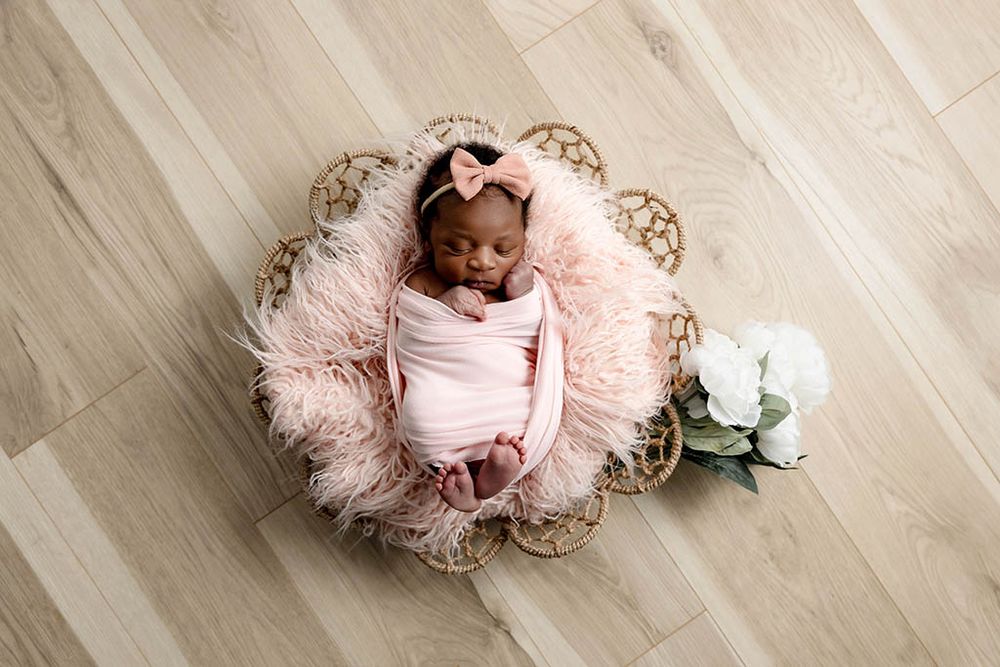 Sleeping newborn baby girl by Hemet baby photographer.