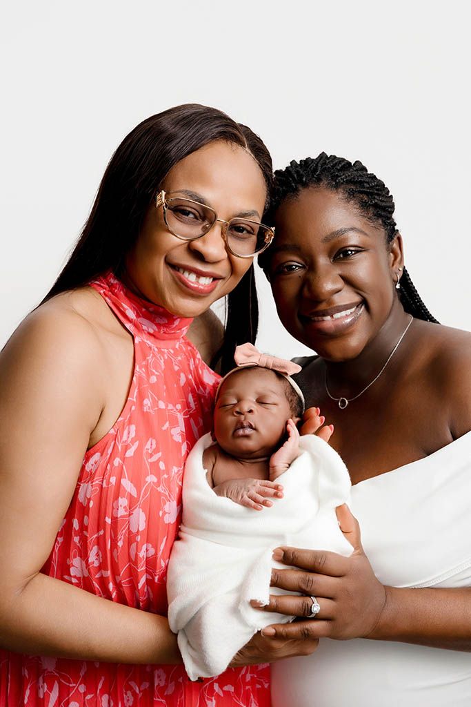 Three generation photo of grandmother, mother, and daughter by Hemet newborn photographer.