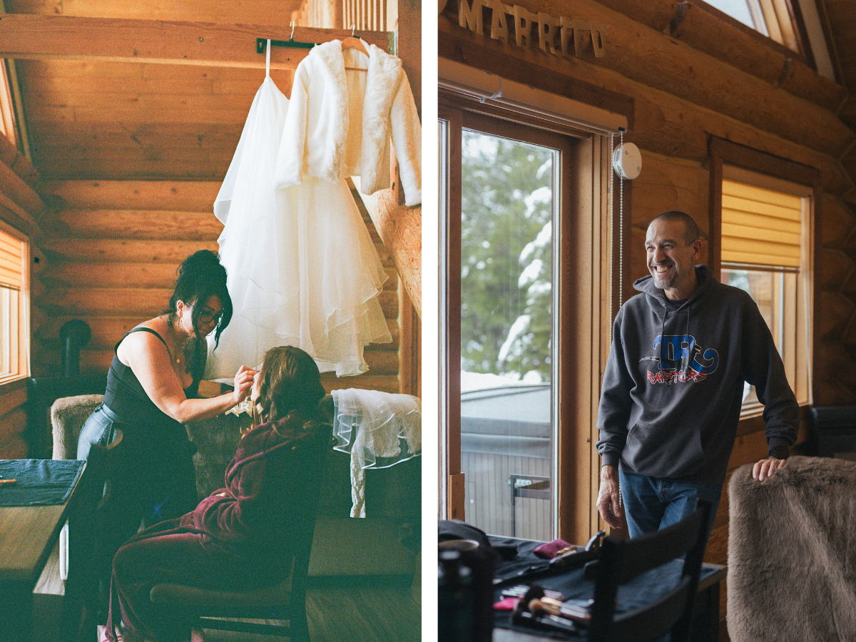 35 mm film photo of a bride getting her makeup done in a cedar log cabin, her dress hanging from the rafters in Revelstoke, BC