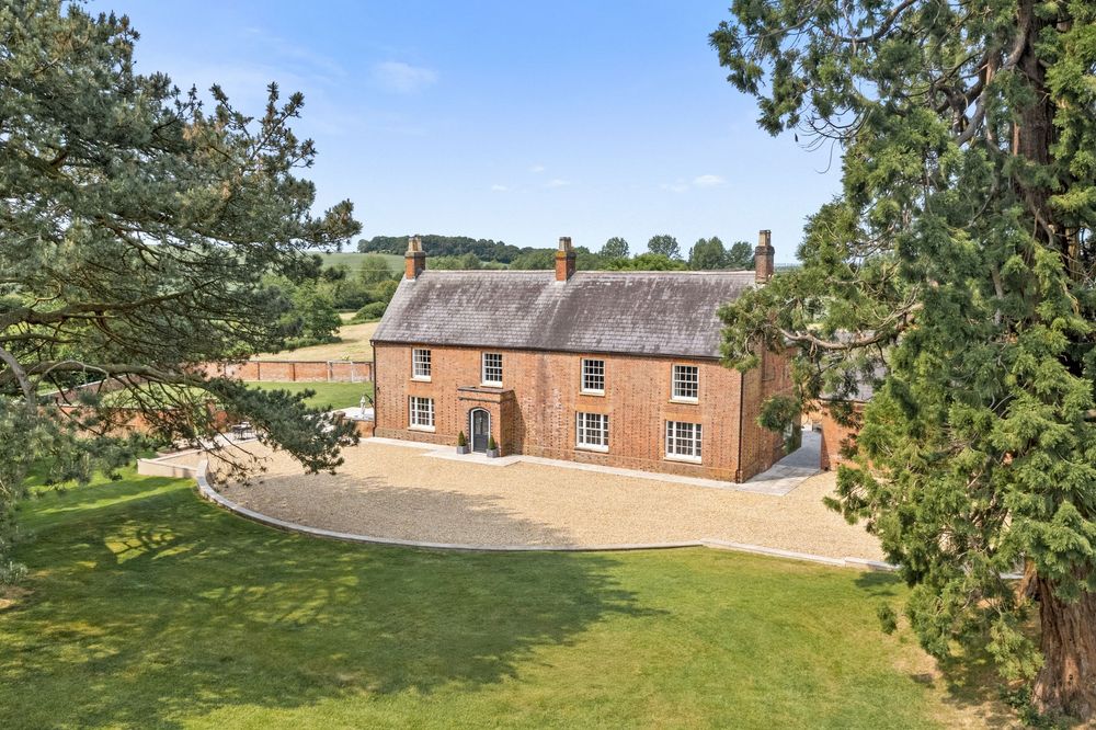 Drone image capturing the externals of a property for a real estate property listing.