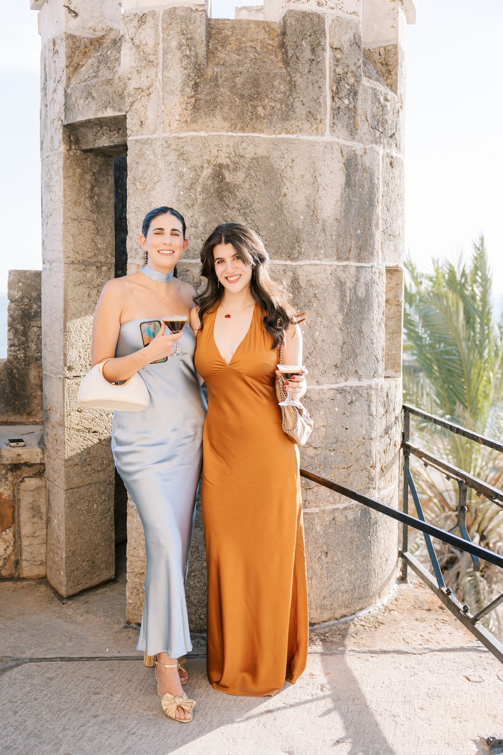 Elegant cocktail setup with drinks and guests at seaside wedding venue in Portugal