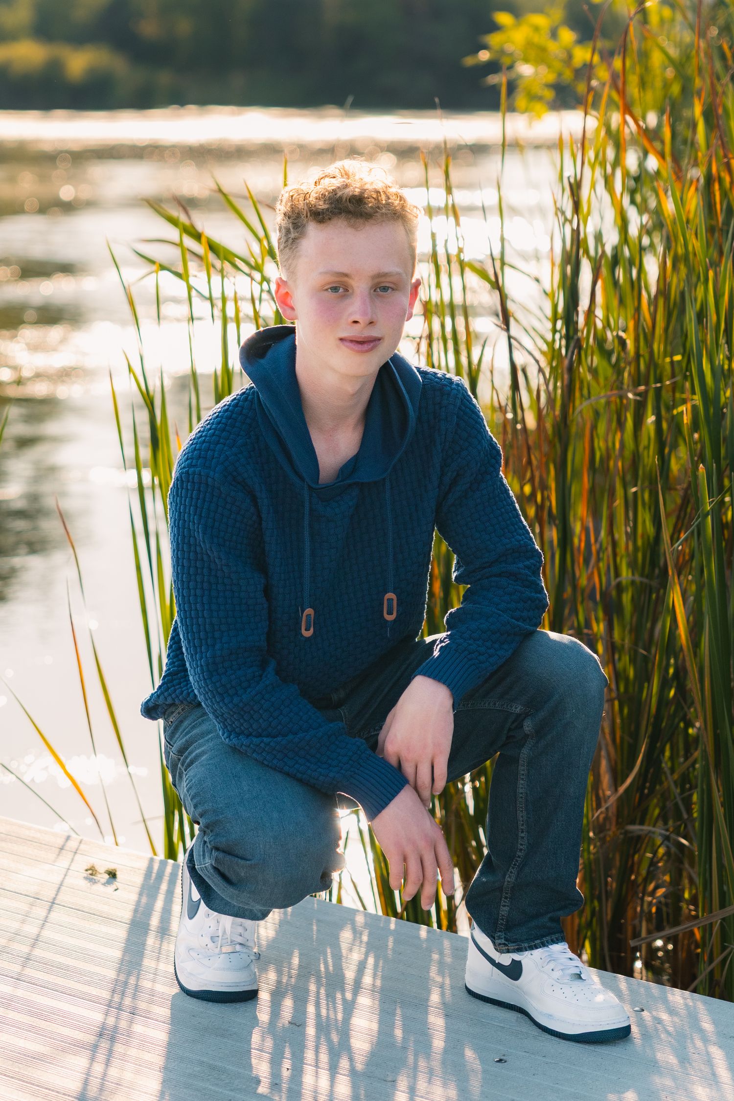 lake kegonsa state park fish camp county boat launch senior photos location unique madison wisconsin beach water grassy boy pose kneeling