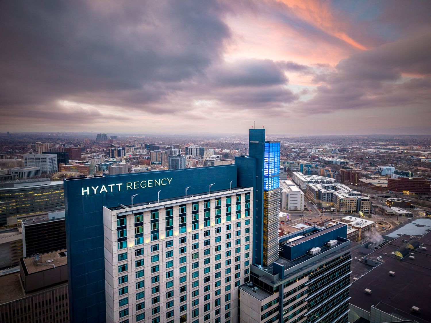Aerial shot of the Hyatt Regency Denver at sunrise by Denver Hospitality, Travel & Tourism photographer Captain Colorado Photography.