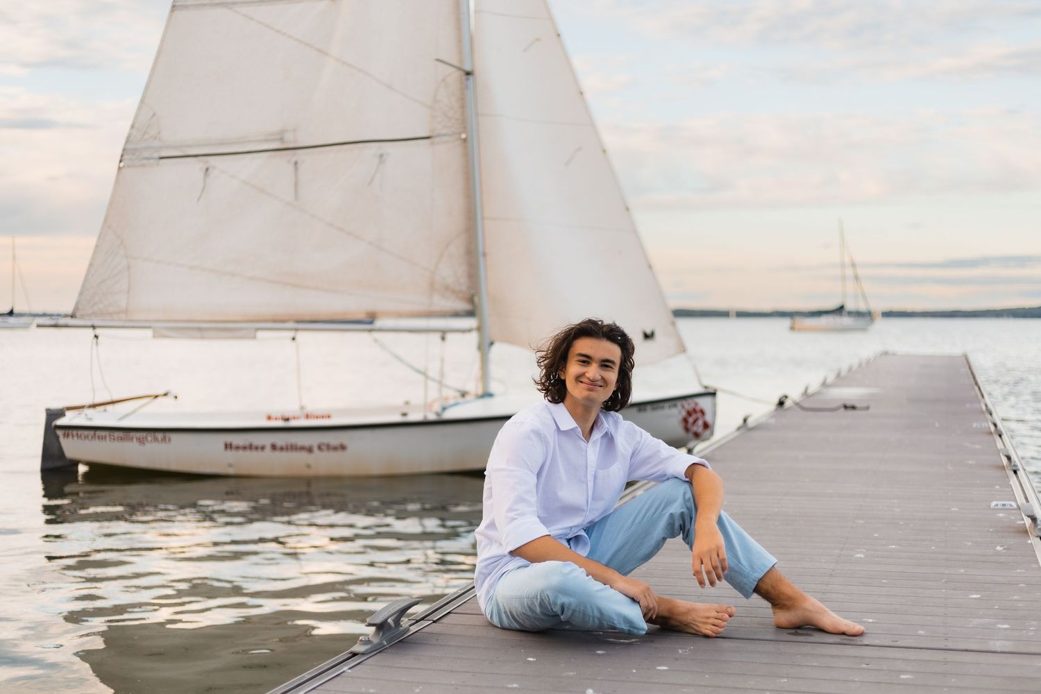 what to wear senior pictures madison wi professional photographer advice outdoor water lake beach blue sky monochromatic scheme blue pants