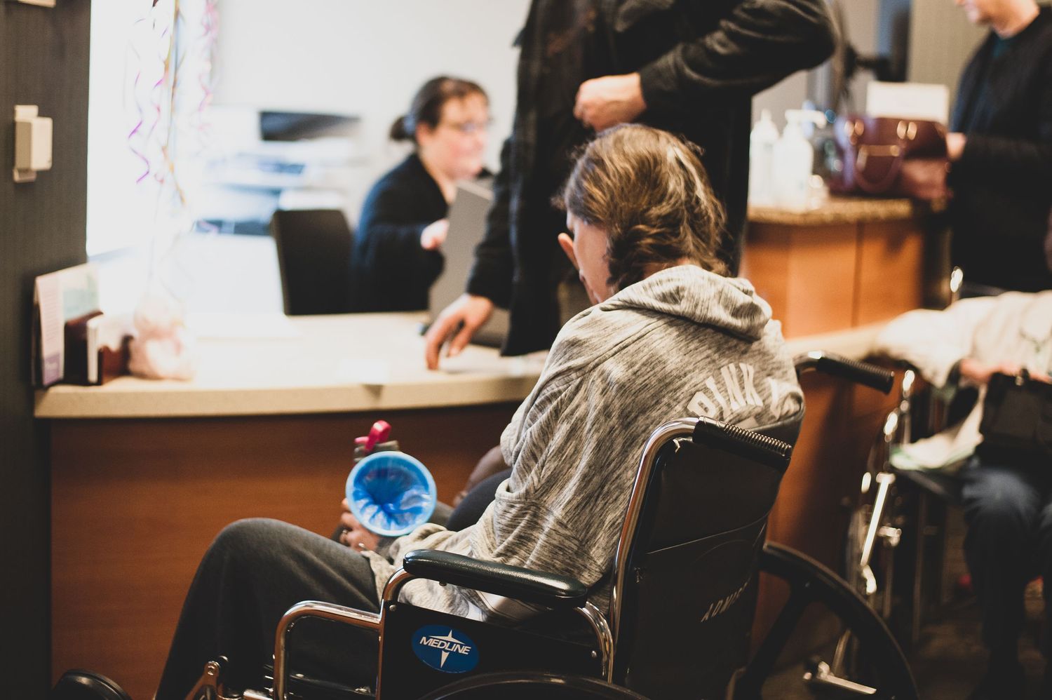 Patient sitting in a wheel chair waiting for a labor and delivery room