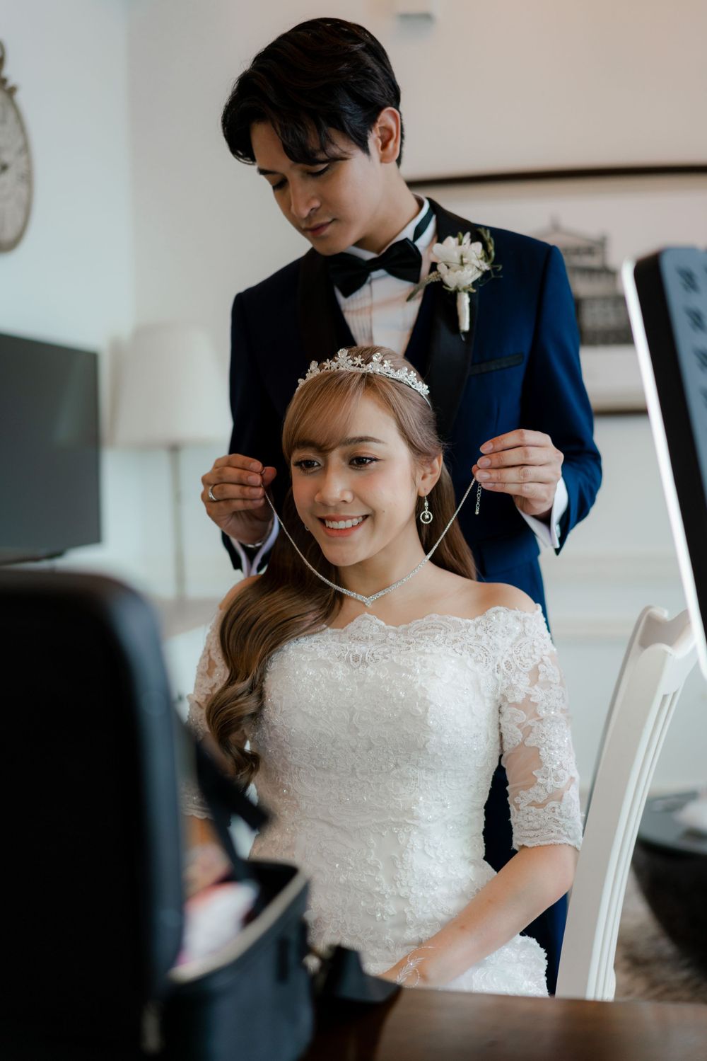 A wedding preparation scene with bridal accessories and styling in progress.