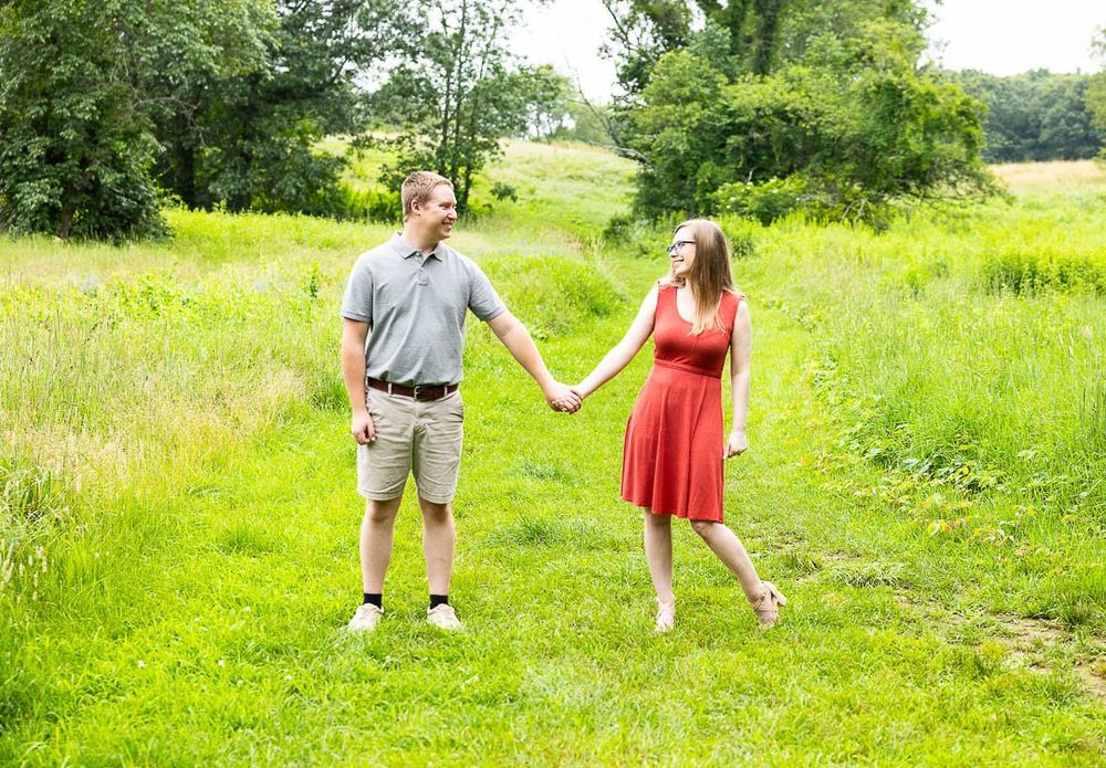 engaged, engagement photographer, engagement session, getting married, wedding plans, photo session, posing ideas, couple walking, fields