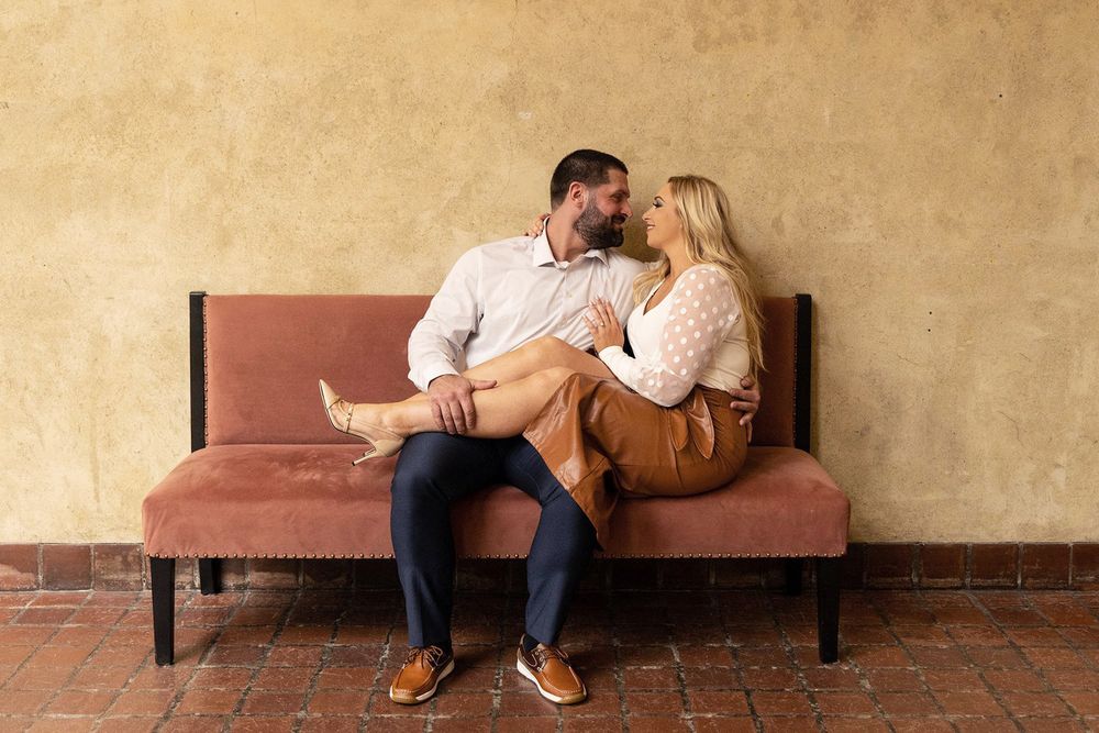 engaged, engagement photographer, engagement session, getting married, wedding plans, wedding ideas, couple on couch, posing ideas, in love