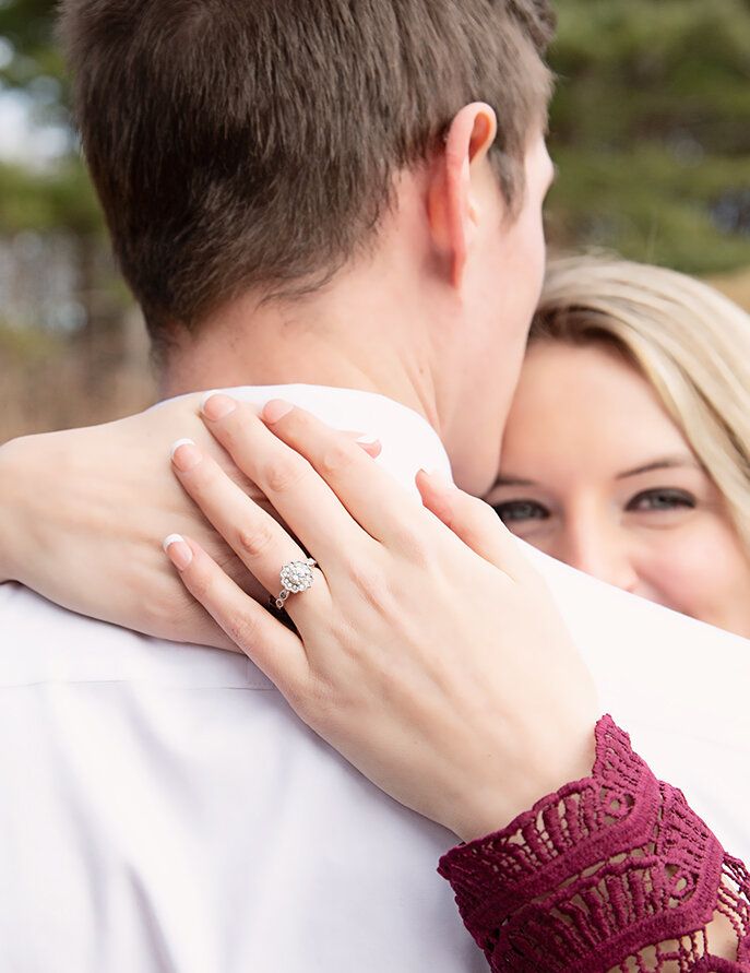 couple embrace, engaged, engagement photographer, engagement session, getting married, wedding plans, engagement rings, wedding rings, bride