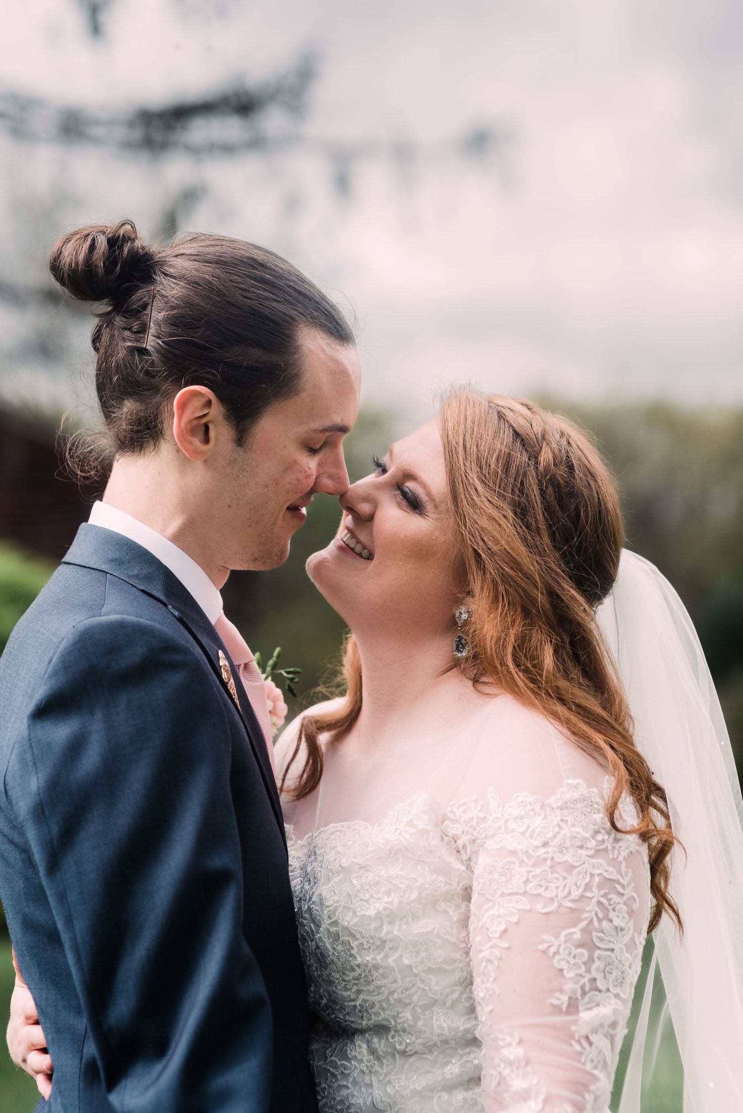 Romantic close-up of a bride and groom sharing an intimate moment on their wedding day.