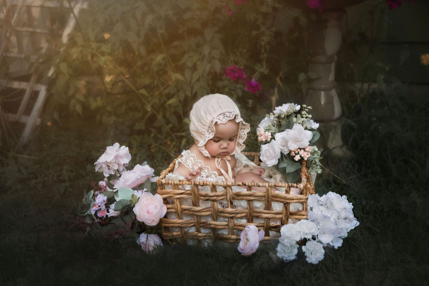 Baby sitting in basket with flowers outside in Portland Oregon