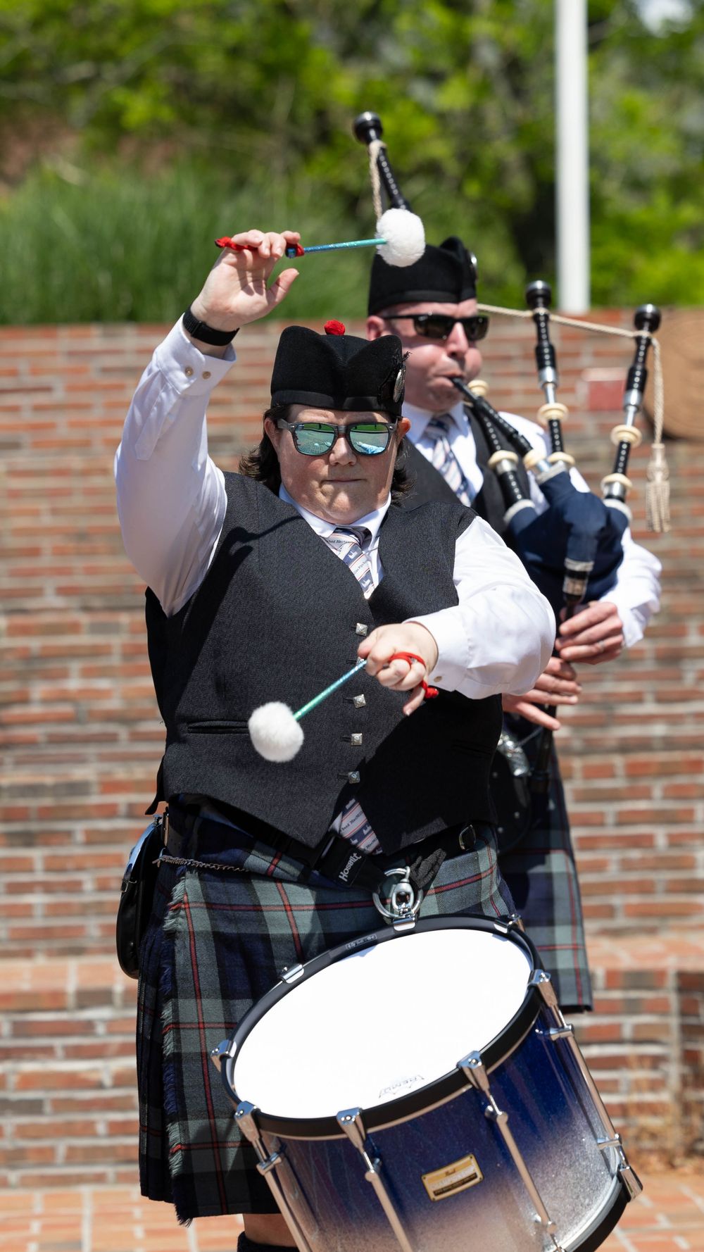 Snare drummer performing in a pipe and drum band